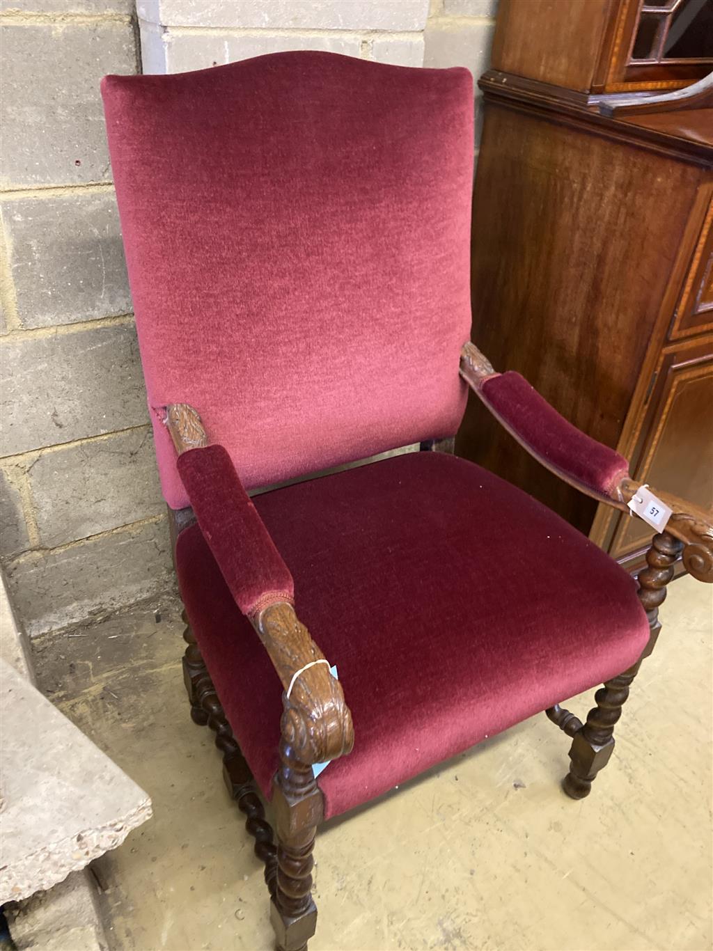 A carved oak Carolean design elbow chair, width 64cm, depth 70cm, height 110cm